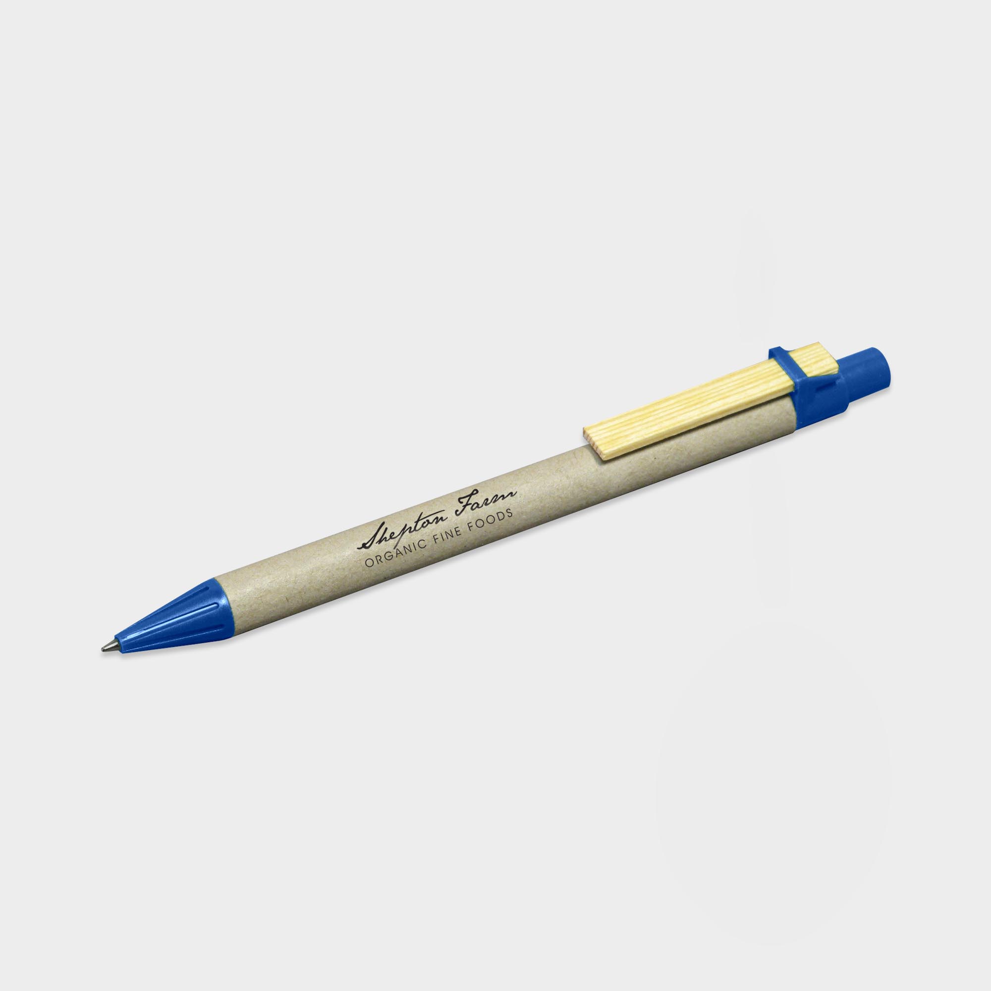 The Green & Good Recycled Card Pen. An eco-friendly pen made from natural recycled cardboard and a wooden clip. Various trim colours available. Made in Germany and comes as standard with blue ink. Blue