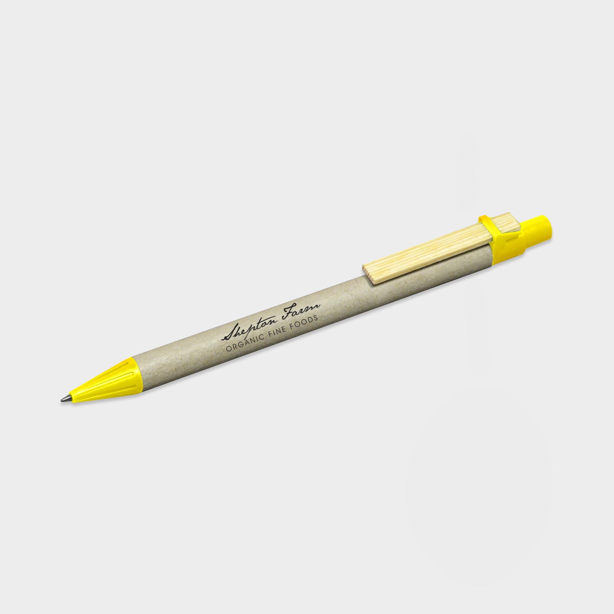 The Green & Good Recycled Card Pen. An eco-friendly pen made from natural recycled cardboard and a wooden clip. Various trim colours available. Made in Germany and comes as standard with blue ink. Yellow